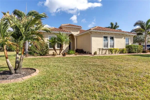 a view of swimming pool with outdoor seating and garden