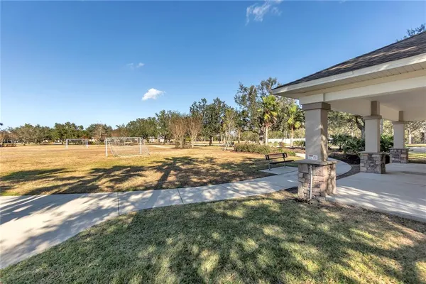 a view of a yard with an outdoor space and seating