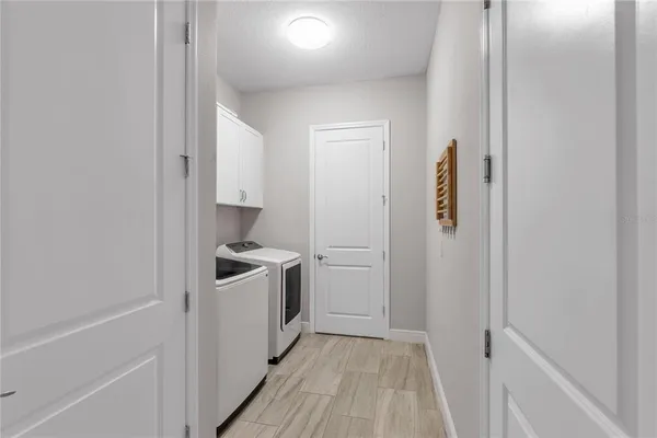 a kitchen with a stove and a refrigerator