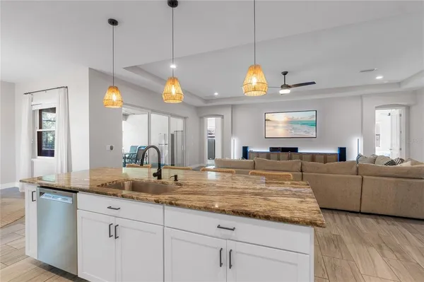a view of living room with granite countertop furniture and fireplace