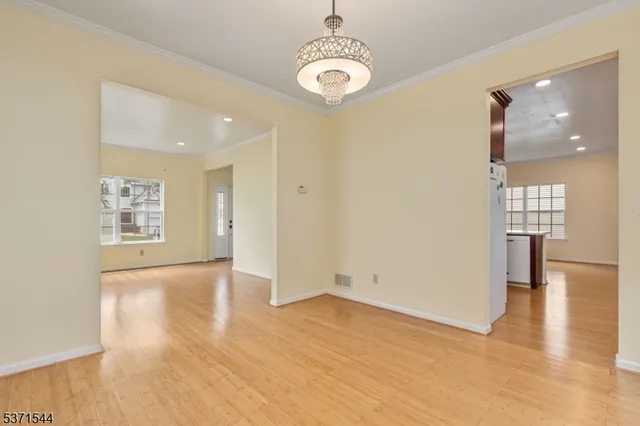 a view of livingroom with hardwood floor and a ceiling fan