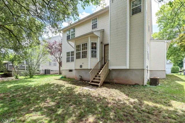 a view of backyard with a garden and trees