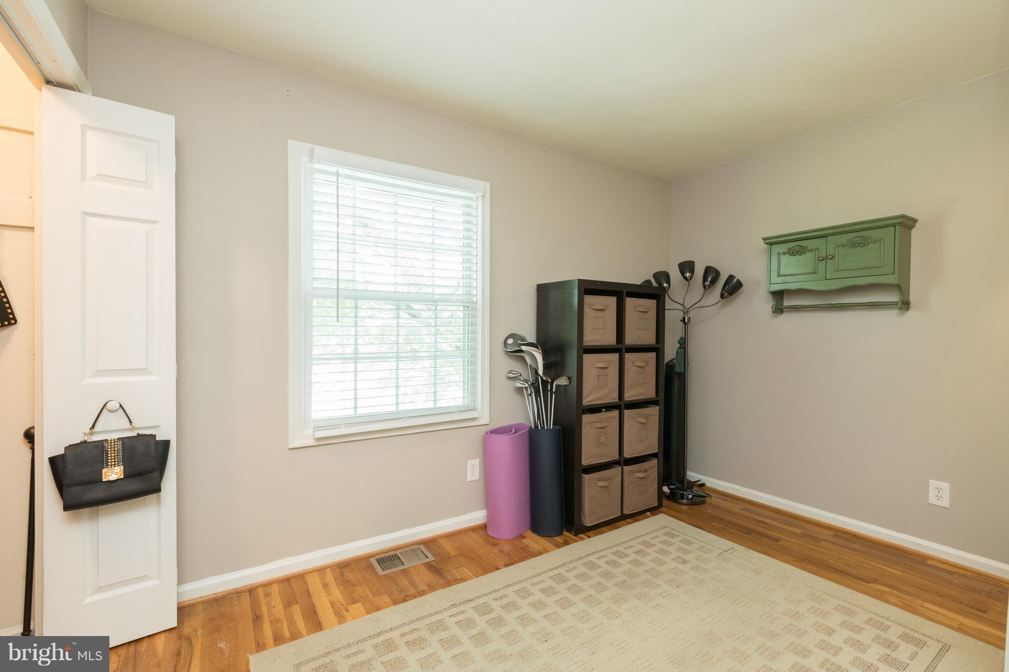 8355 Dunham Court, Unit 607 Springfield, VA 22152 - Photo 13 of 15 a view of a livingroom with wooden floor and a window