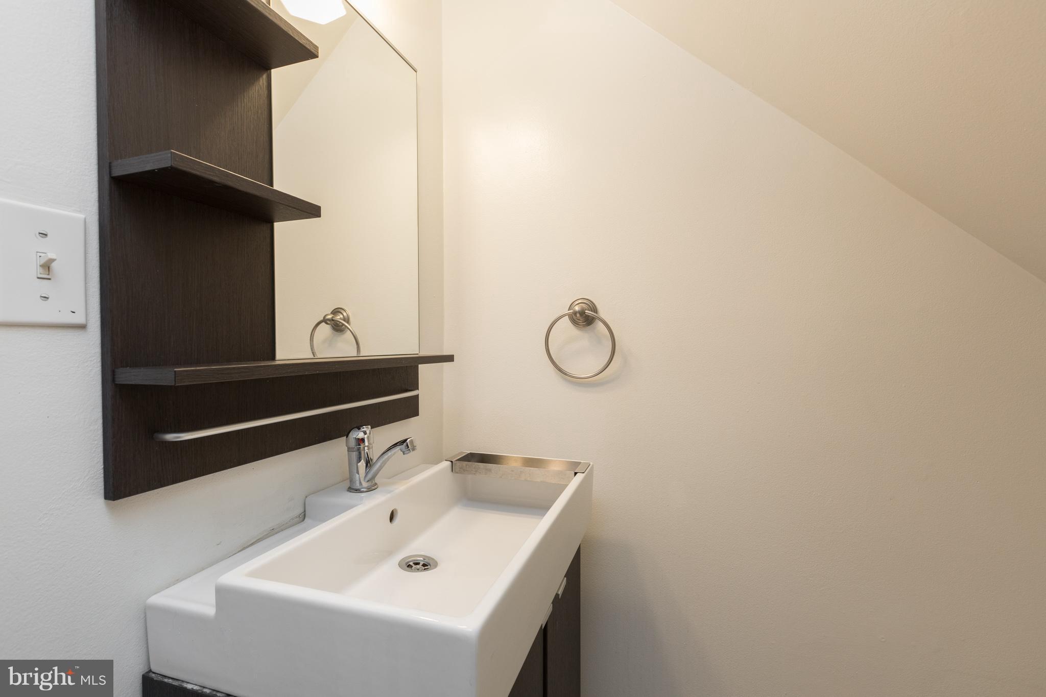 8355 Dunham Court, Unit 607 Springfield, VA 22152 - Photo 8 of 15 a bathroom with a sink and a mirror