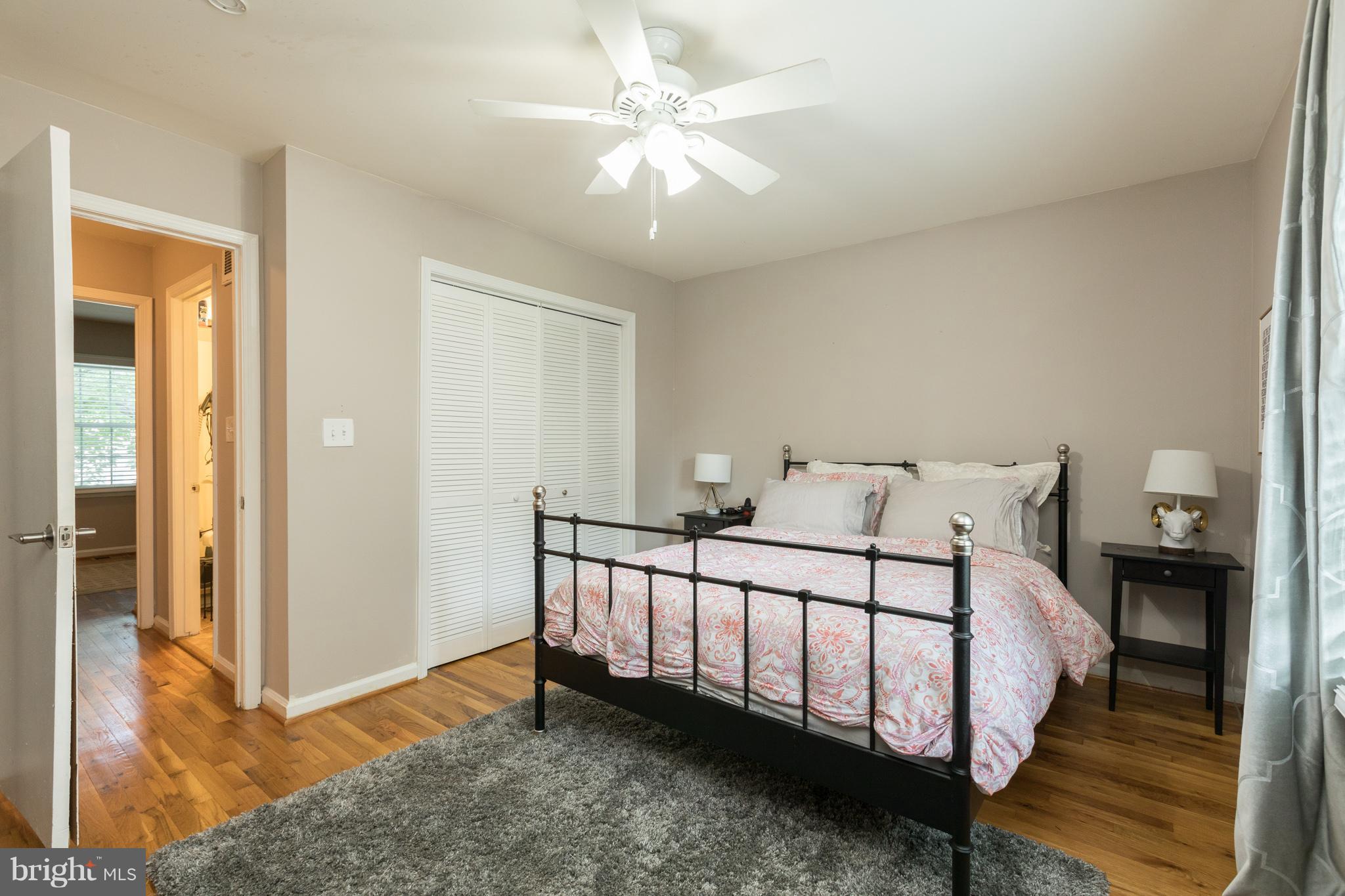 8355 Dunham Court, Unit 607 Springfield, VA 22152 - Photo 9 of 15 a bed room with a bed and a chandelier