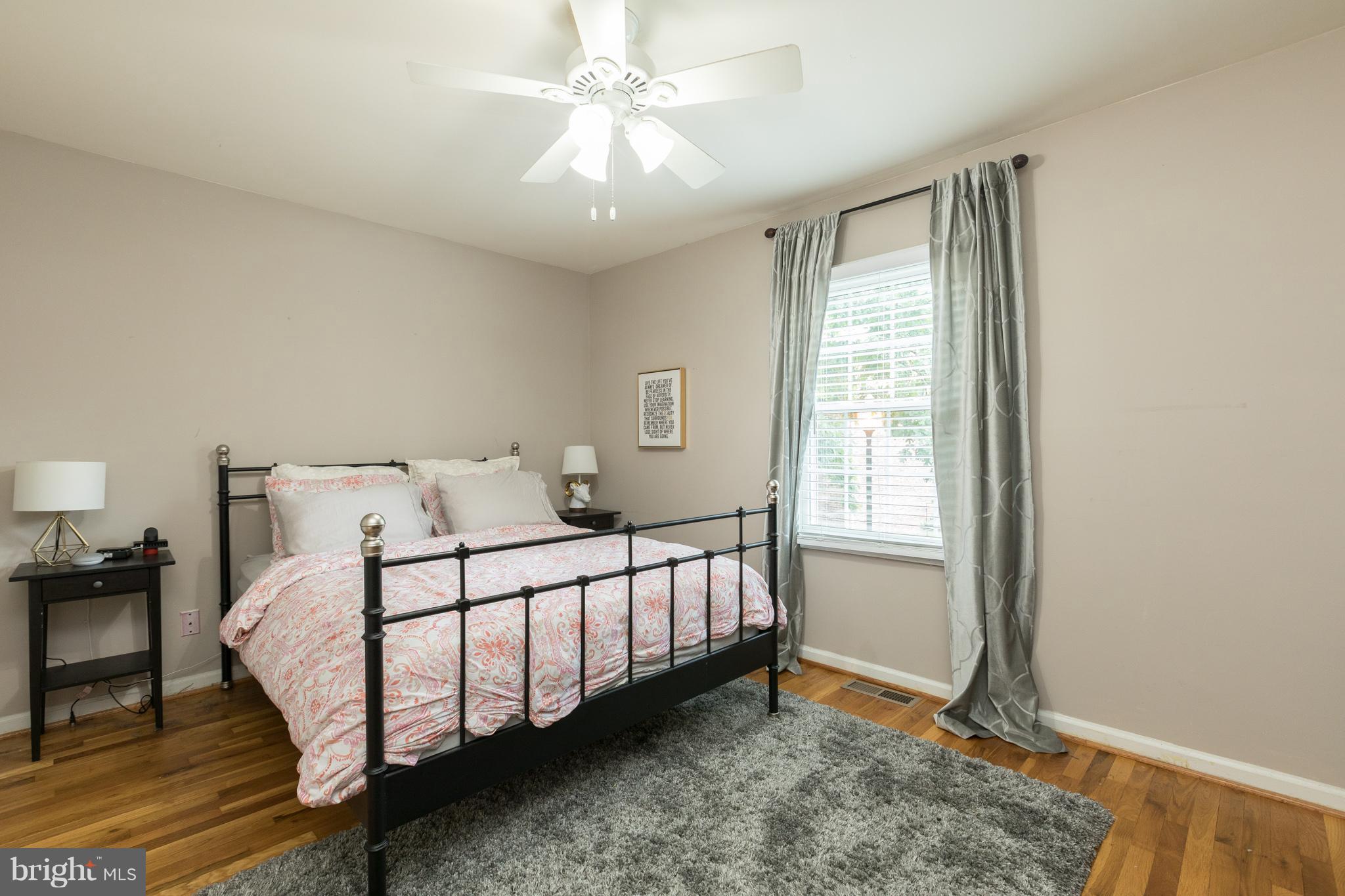 8355 Dunham Court, Unit 607 Springfield, VA 22152 - Photo 10 of 15 a bedroom with a bed and a window