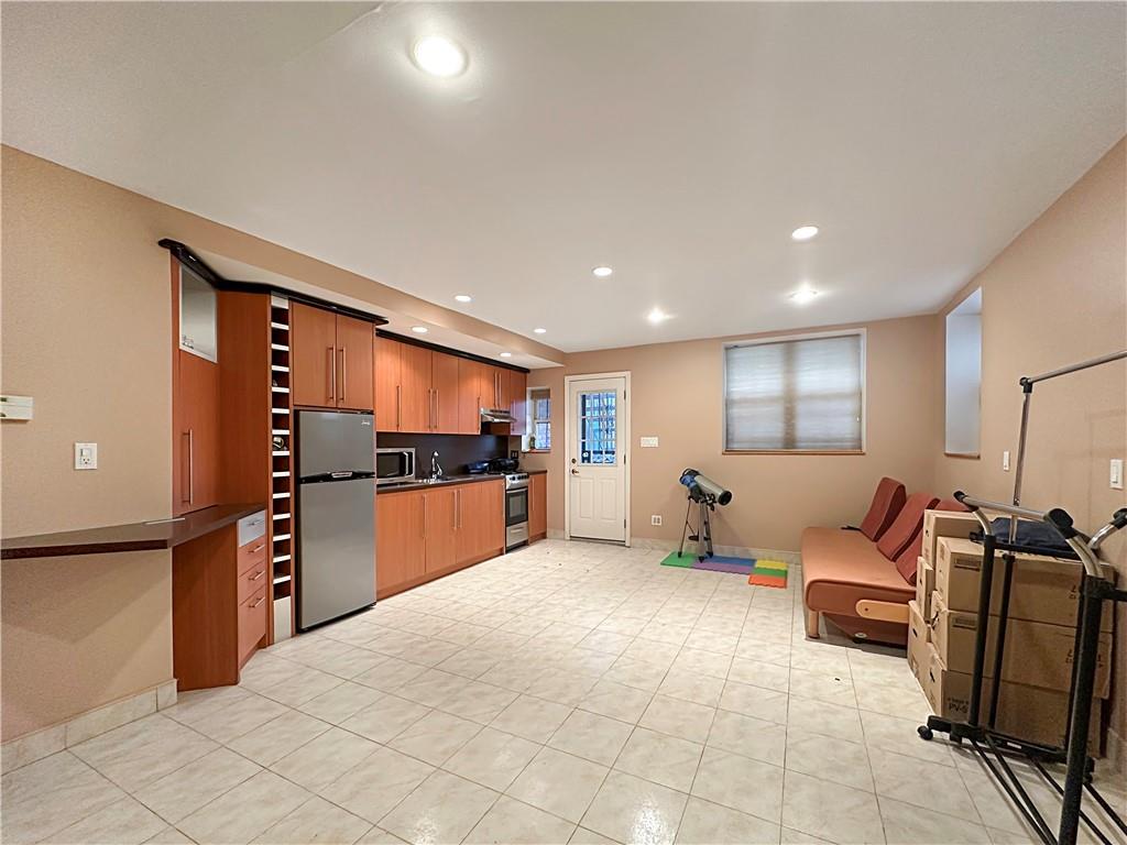 18 Corbin Place Brooklyn, NY 11235 - Photo 19 of 22 a living room with furniture and a flat screen tv