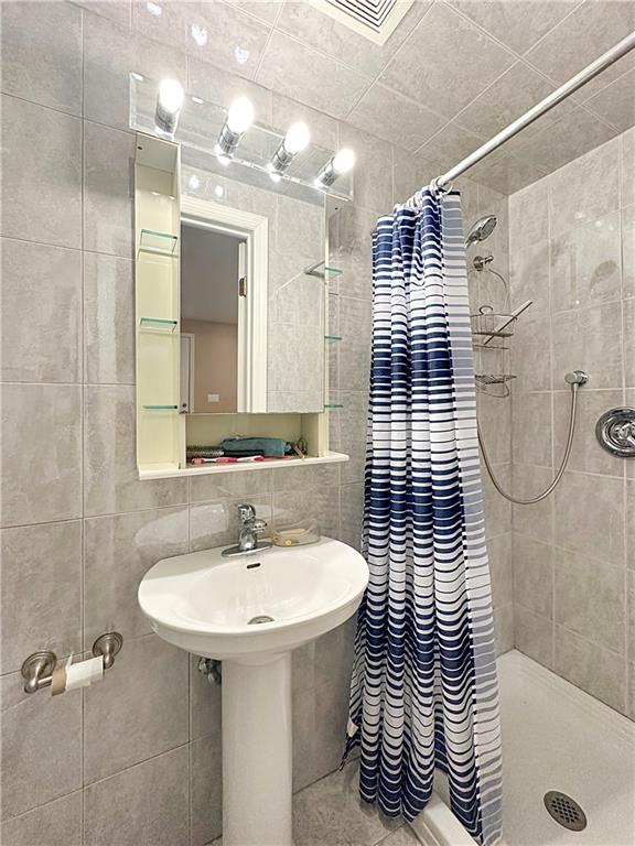 18 Corbin Place Brooklyn, NY 11235 - Photo 22 of 22 a bathroom with a sink a toilet and shower