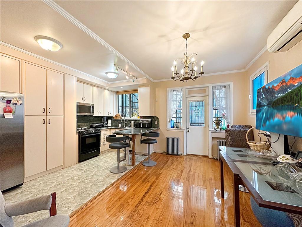 18 Corbin Place Brooklyn, NY 11235 - Photo 5 of 22 a kitchen with stainless steel appliances granite countertop a stove refrigerator and a sink