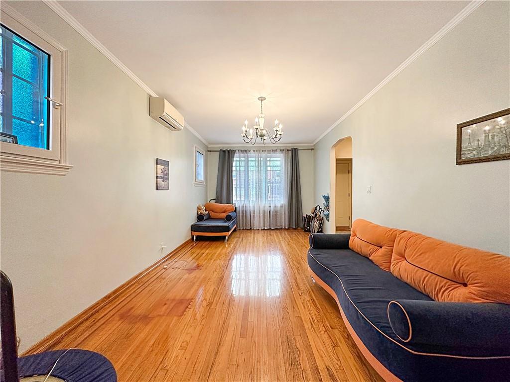 18 Corbin Place Brooklyn, NY 11235 - Photo 7 of 22 a living room with furniture and a wooden floor