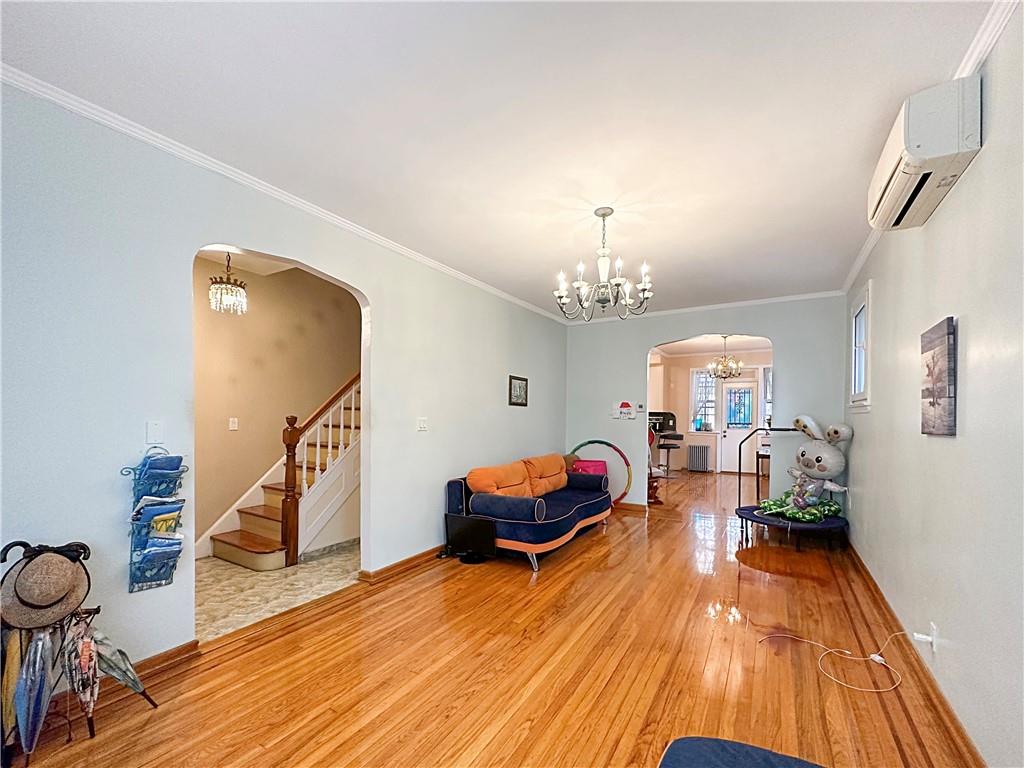 18 Corbin Place Brooklyn, NY 11235 - Photo 8 of 22 a living room with furniture and a wooden floor