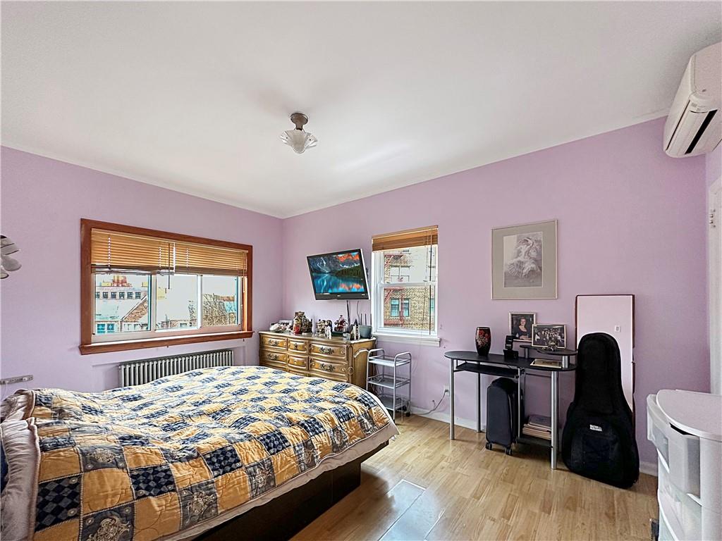 18 Corbin Place Brooklyn, NY 11235 - Photo 9 of 22 a bedroom with a bed and a window