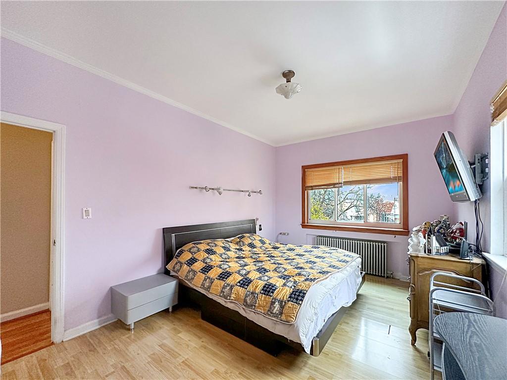 18 Corbin Place Brooklyn, NY 11235 - Photo 10 of 22 a bedroom with a bed couch and window