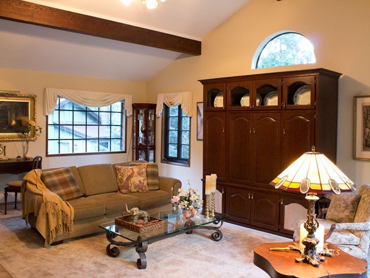 55870 Encino Road Idyllwild, CA 92549 - Photo 3 of 29 a living room with furniture a rug and a chandelier