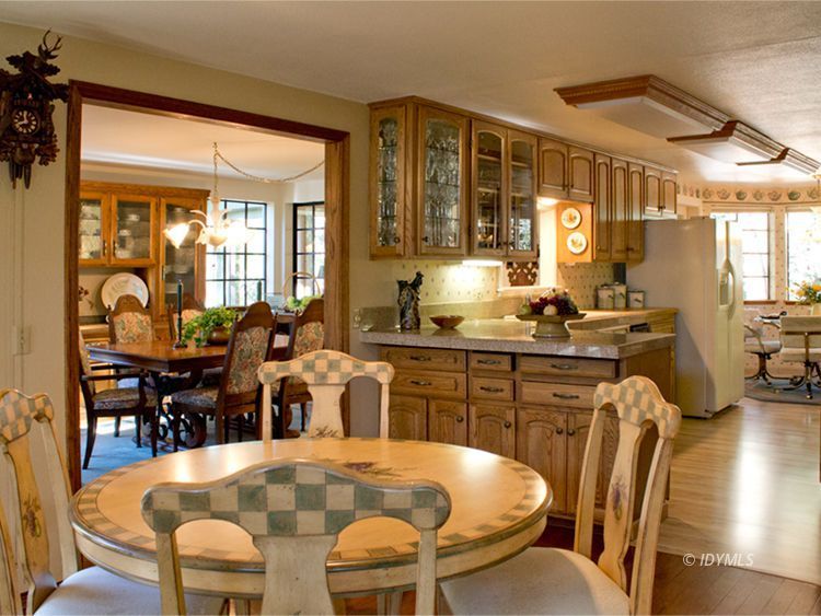 55870 Encino Road Idyllwild, CA 92549 - Photo 6 of 29 a kitchen with stainless steel appliances dining table and chairs