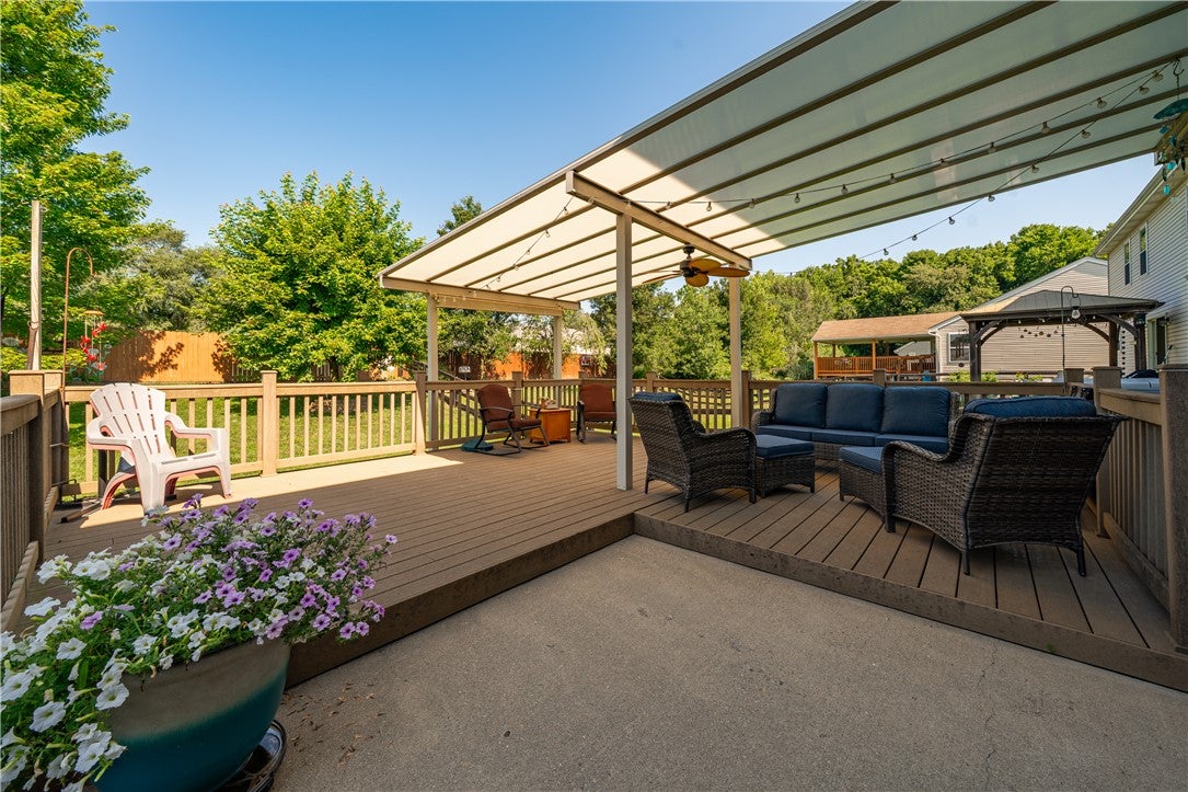 10765 Stone Ridge Way Harrison, OH 45030 - Photo 57 of 68 A spacious, multi-level deck invites relaxation and alfresco entertaining, featuring an outdoor ceiling fan and strung lighting.