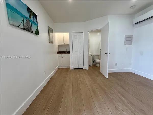 a view of hallway with wooden floor