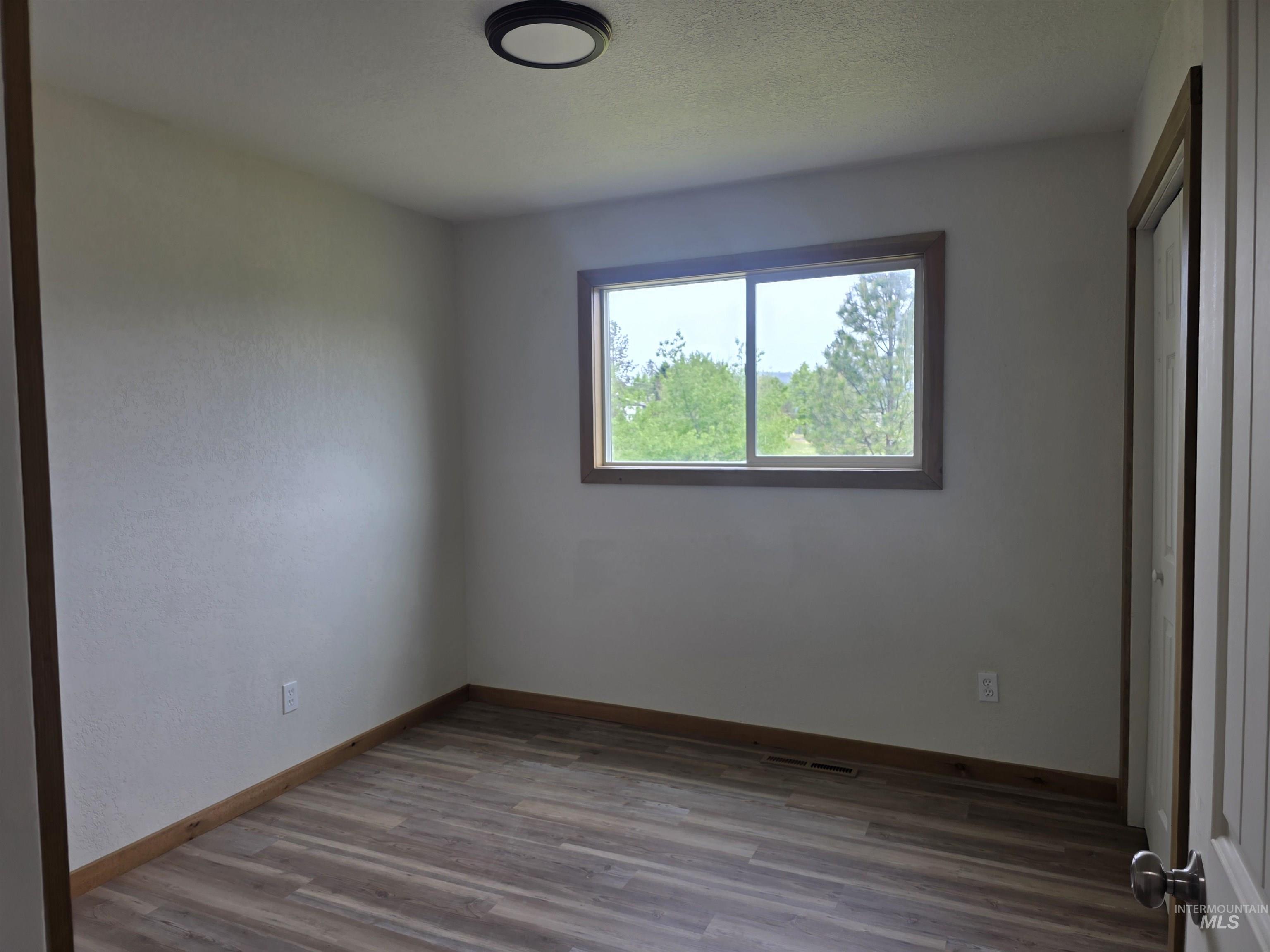 310 Fir Road Kamiah, ID 83536 - Photo 25 of 32 Neutral wall finishes with a window offering natural light