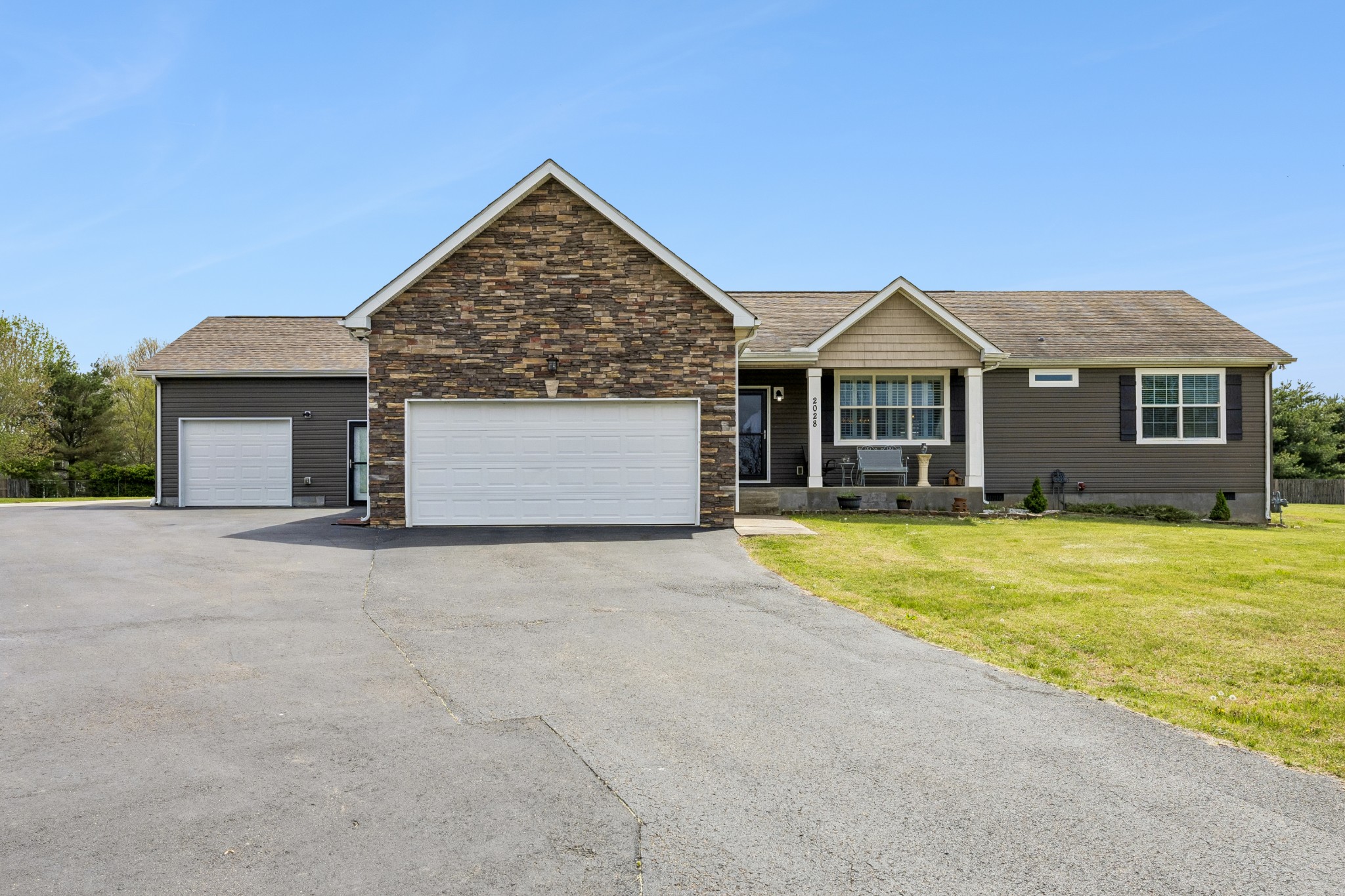 2028 Mason Lane Spring Hill, TN 37174 - Photo 2 of 25 a front view of a house with a yard and garage