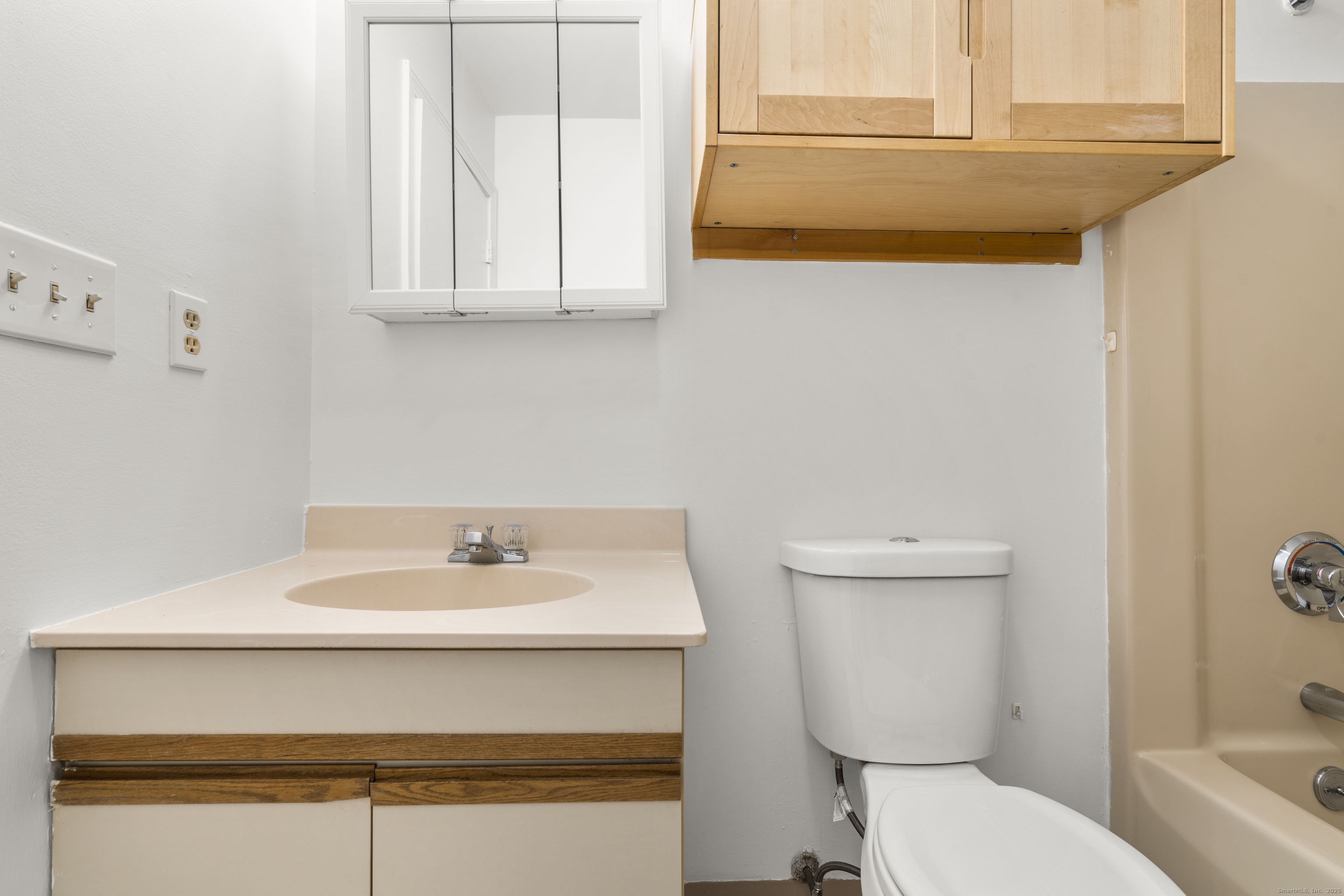 233 Derby Avenue, Unit 611 Derby, CT 06418 - Photo 11 of 19 a bathroom with a sink a toilet and mirror