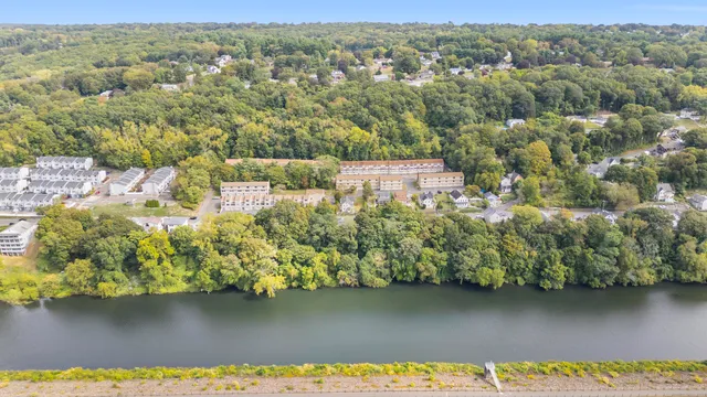 an aerial view of a house with a lake view