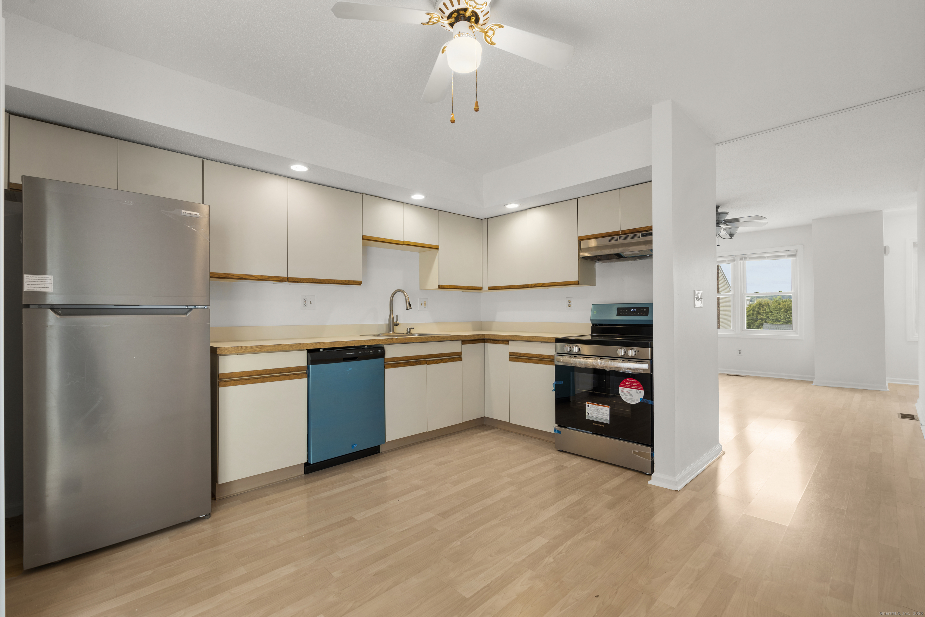 233 Derby Avenue, Unit 611 Derby, CT 06418 - Photo 2 of 19 a kitchen with a refrigerator and a sink