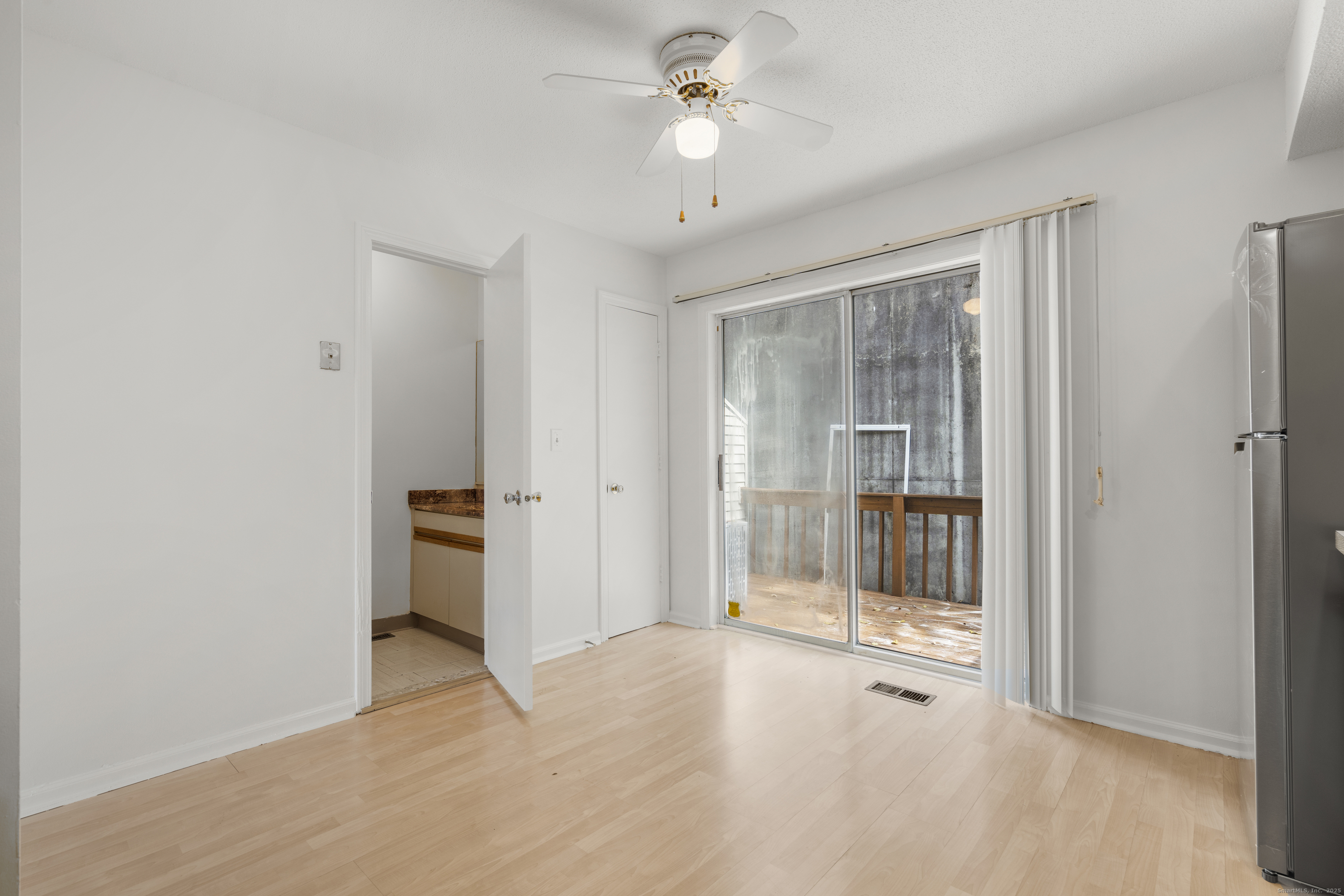 233 Derby Avenue, Unit 611 Derby, CT 06418 - Photo 3 of 19 a view of a room with an empty space and a ceiling fan