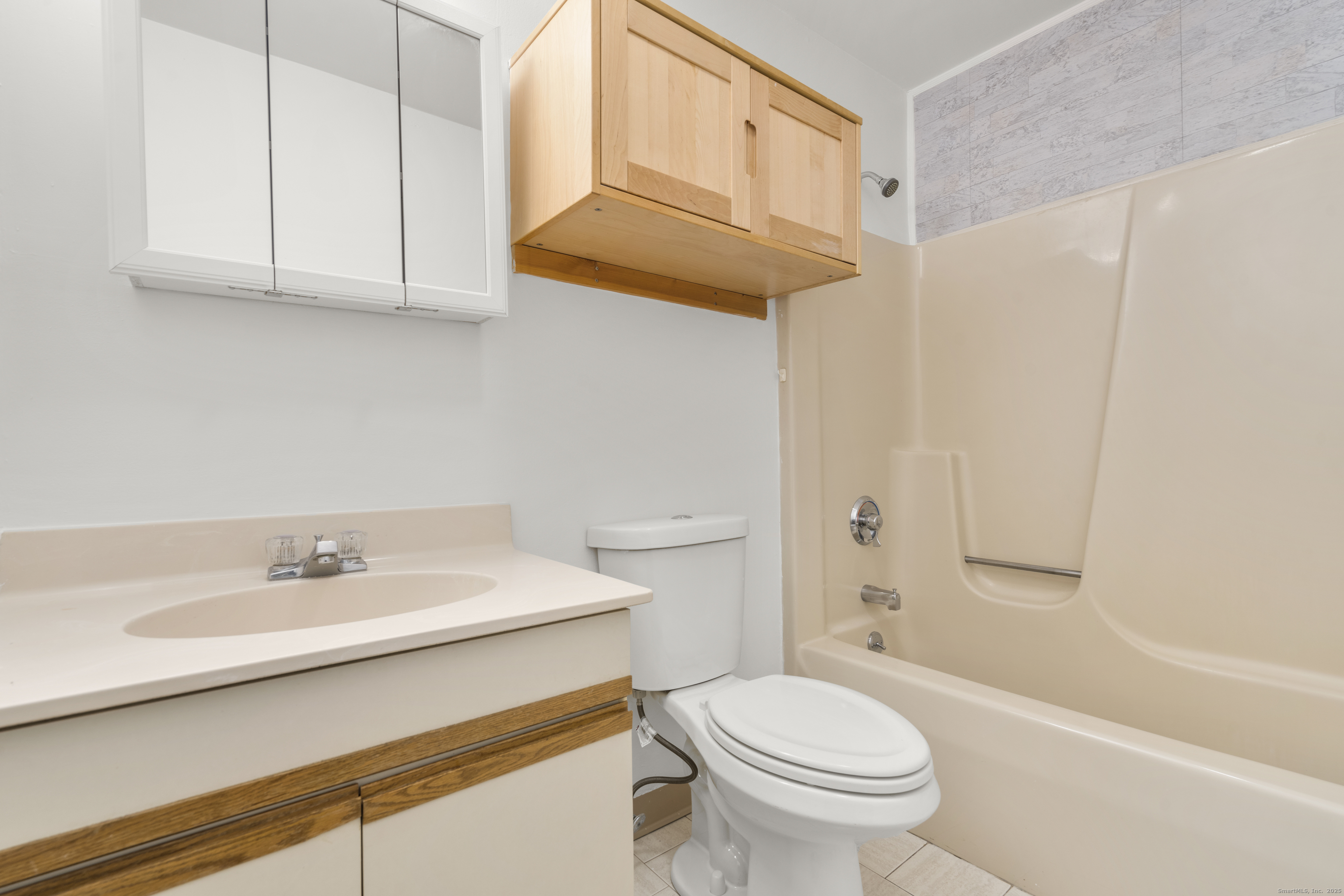 233 Derby Avenue, Unit 611 Derby, CT 06418 - Photo 10 of 19 a bathroom with a sink a toilet and a bathtub