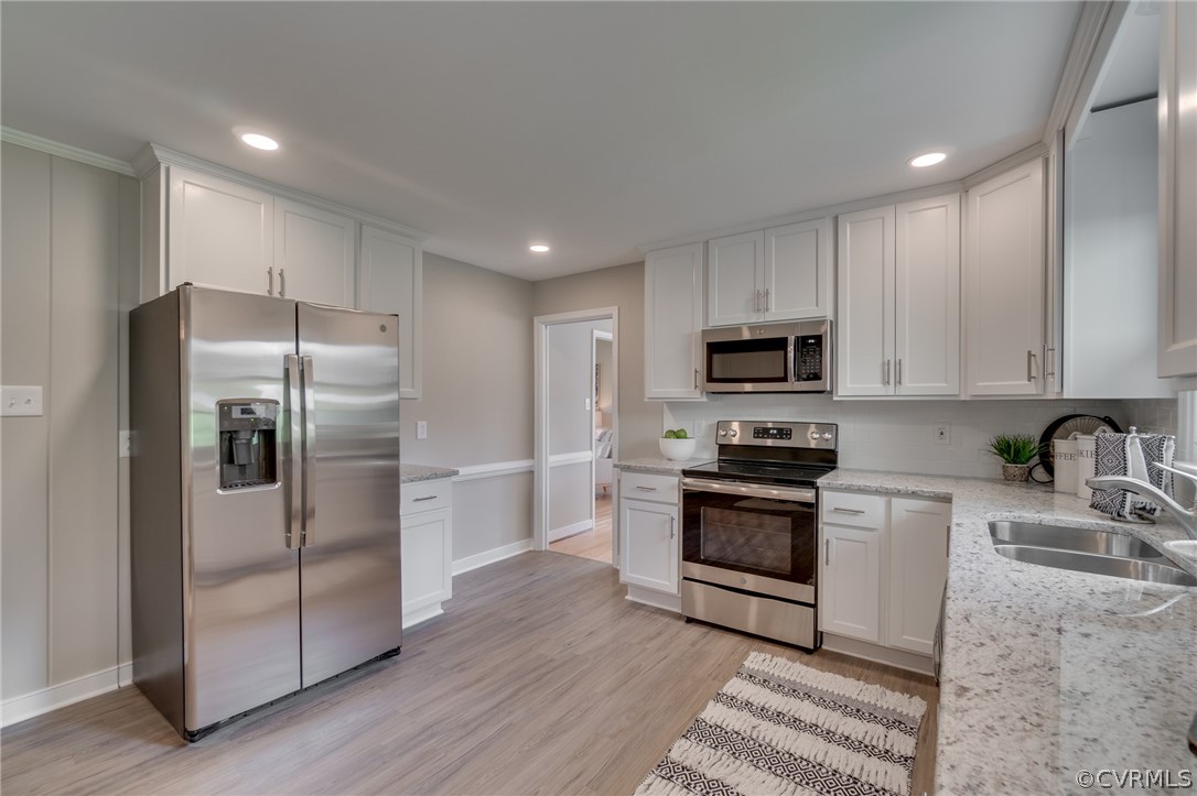 3908 Dunraven Road Chesterfield, VA 23236 - Photo 16 of 44 a kitchen with stainless steel appliances granite countertop a refrigerator a stove and a sink