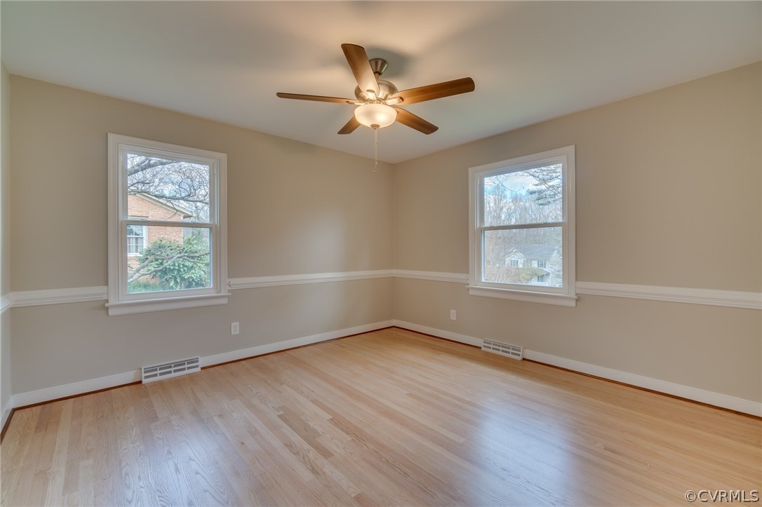 3908 Dunraven Road Chesterfield, VA 23236 - Photo 23 of 44 an empty room with wooden floor windows and fan