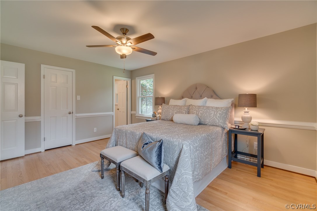 3908 Dunraven Road Chesterfield, VA 23236 - Photo 26 of 44 a bedroom with a bed and a chandelier