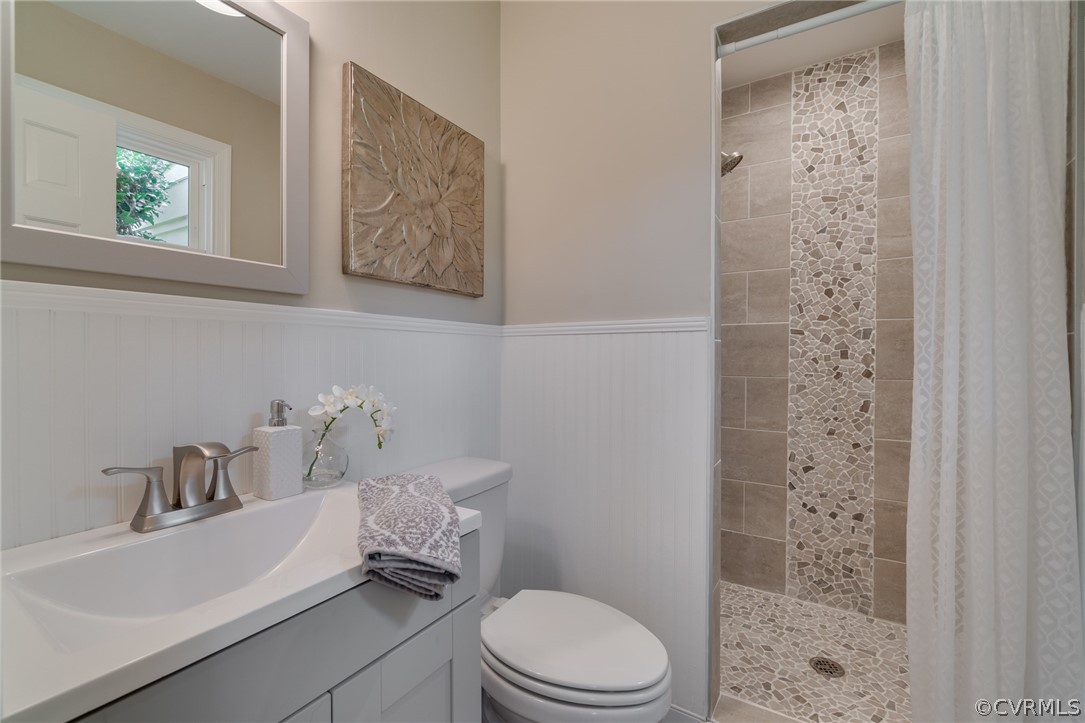 3908 Dunraven Road Chesterfield, VA 23236 - Photo 28 of 44 a bathroom with a sink a toilet and shower