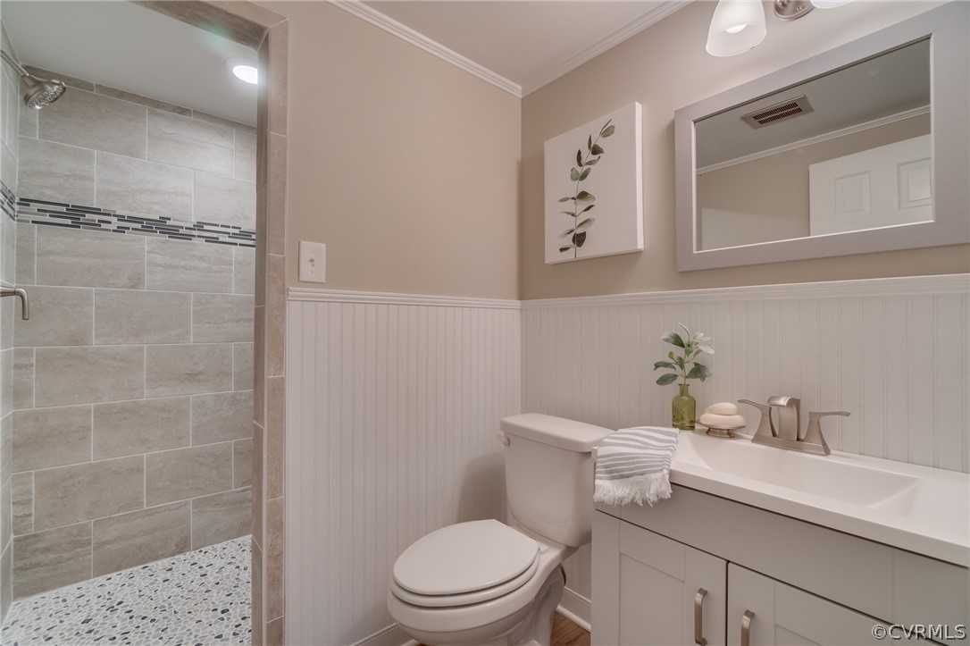 3908 Dunraven Road Chesterfield, VA 23236 - Photo 35 of 44 a white toilet sitting next to a bathroom sink