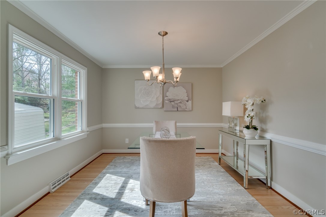 3908 Dunraven Road Chesterfield, VA 23236 - Photo 8 of 44 a dining room with furniture a chandelier and window