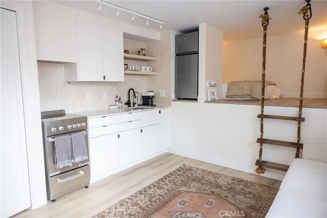 a kitchen with a sink and cabinets