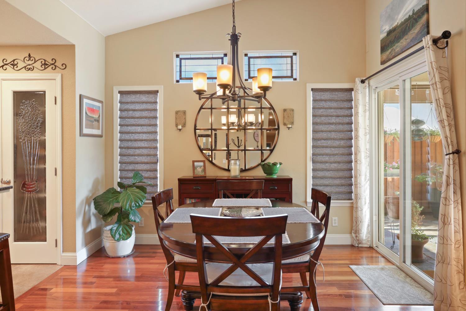 2832 Remington Way Tracy, CA 95377 - Photo 14 of 67 a view of a dining room with furniture window and wooden floor
