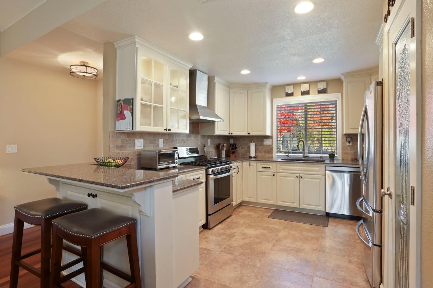 2832 Remington Way Tracy, CA 95377 - Photo 18 of 67 a kitchen with sink cabinets and window