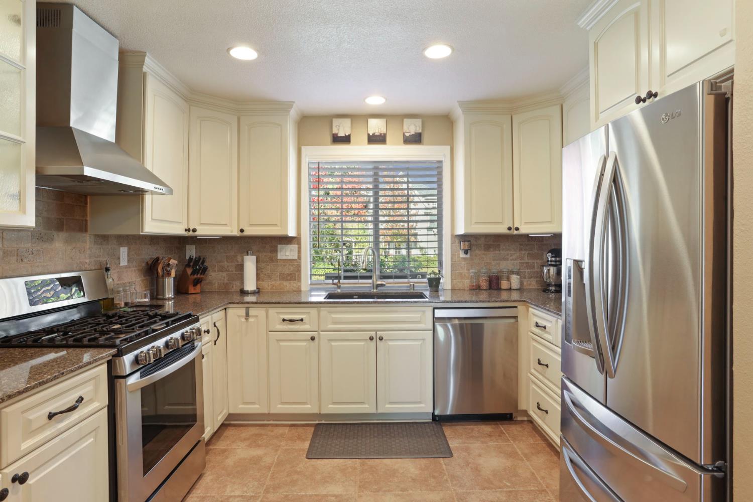 2832 Remington Way Tracy, CA 95377 - Photo 20 of 67 a kitchen with stainless steel appliances a refrigerator sink and cabinets