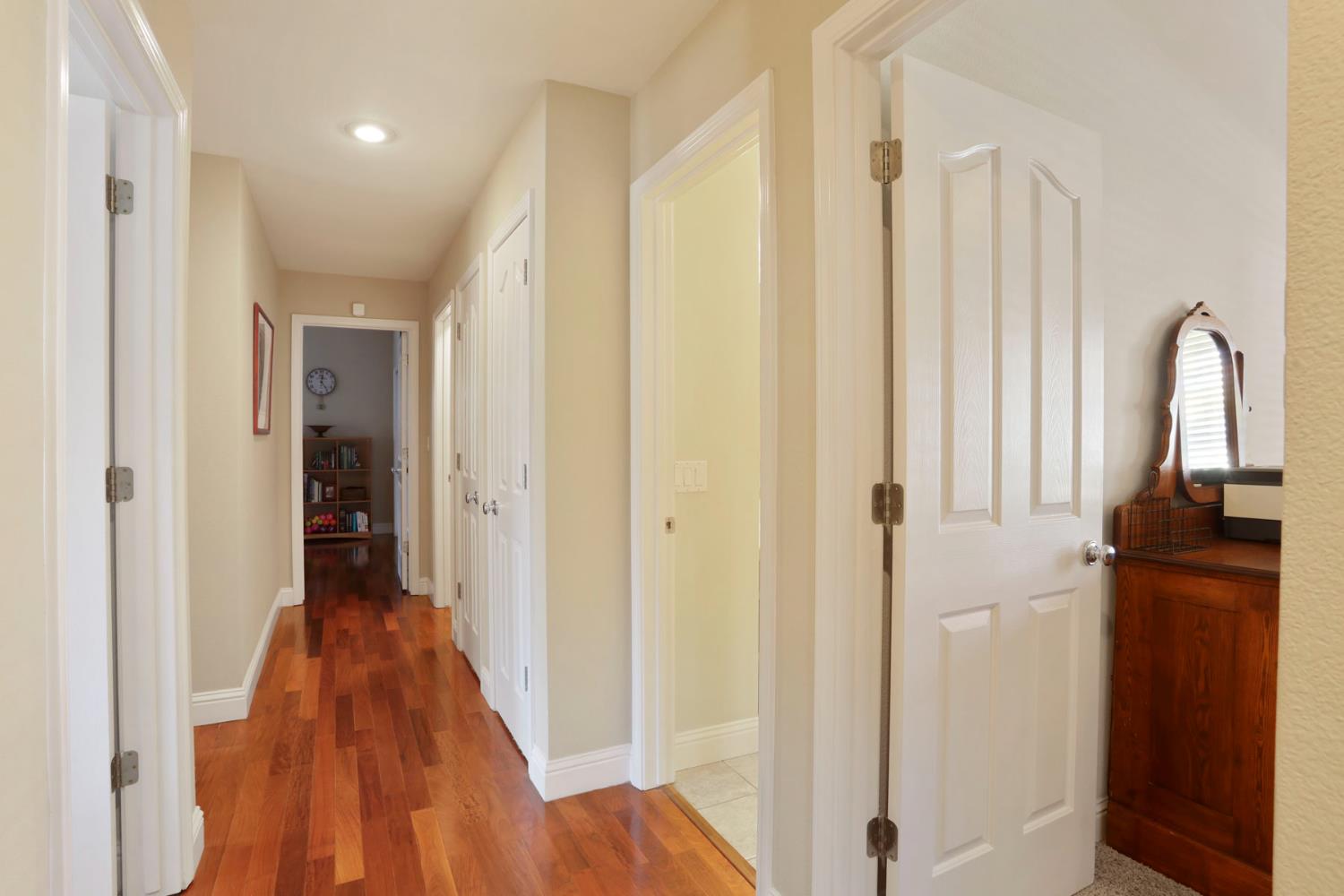 2832 Remington Way Tracy, CA 95377 - Photo 22 of 67 a view of a hallway with wooden floor and staircase