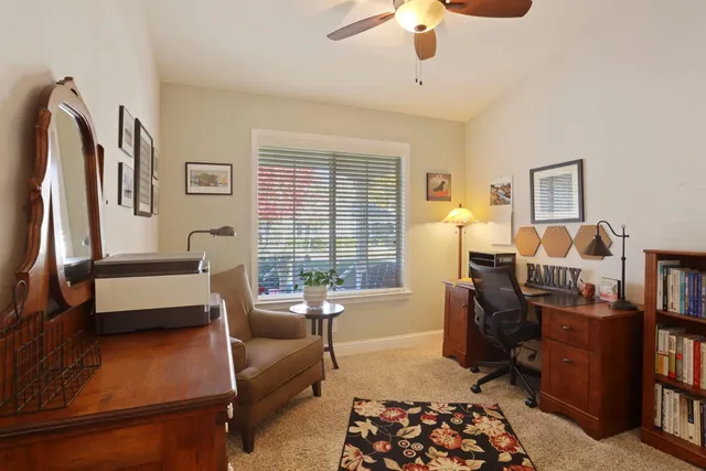 a bed room with a bed and a chandelier