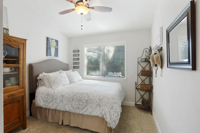 a bed room with a bed and a chandelier