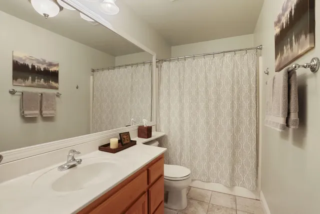 a bathroom with a shower and a sink