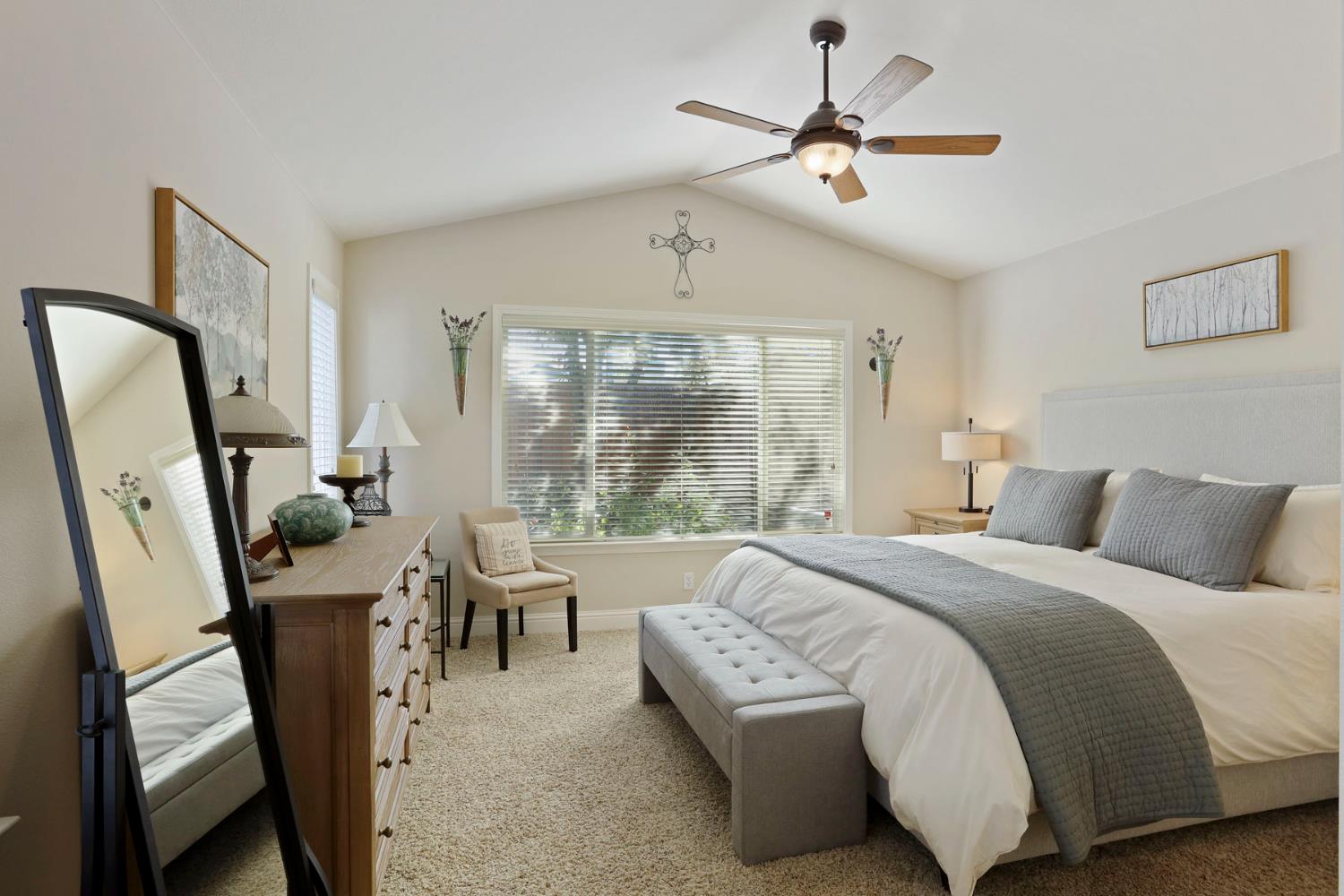 2832 Remington Way Tracy, CA 95377 - Photo 29 of 67 a bed room with a bed and a chandelier