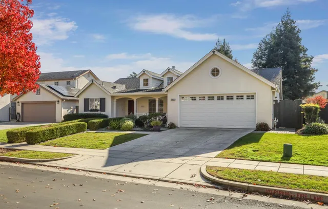 front view of a house with potted plants