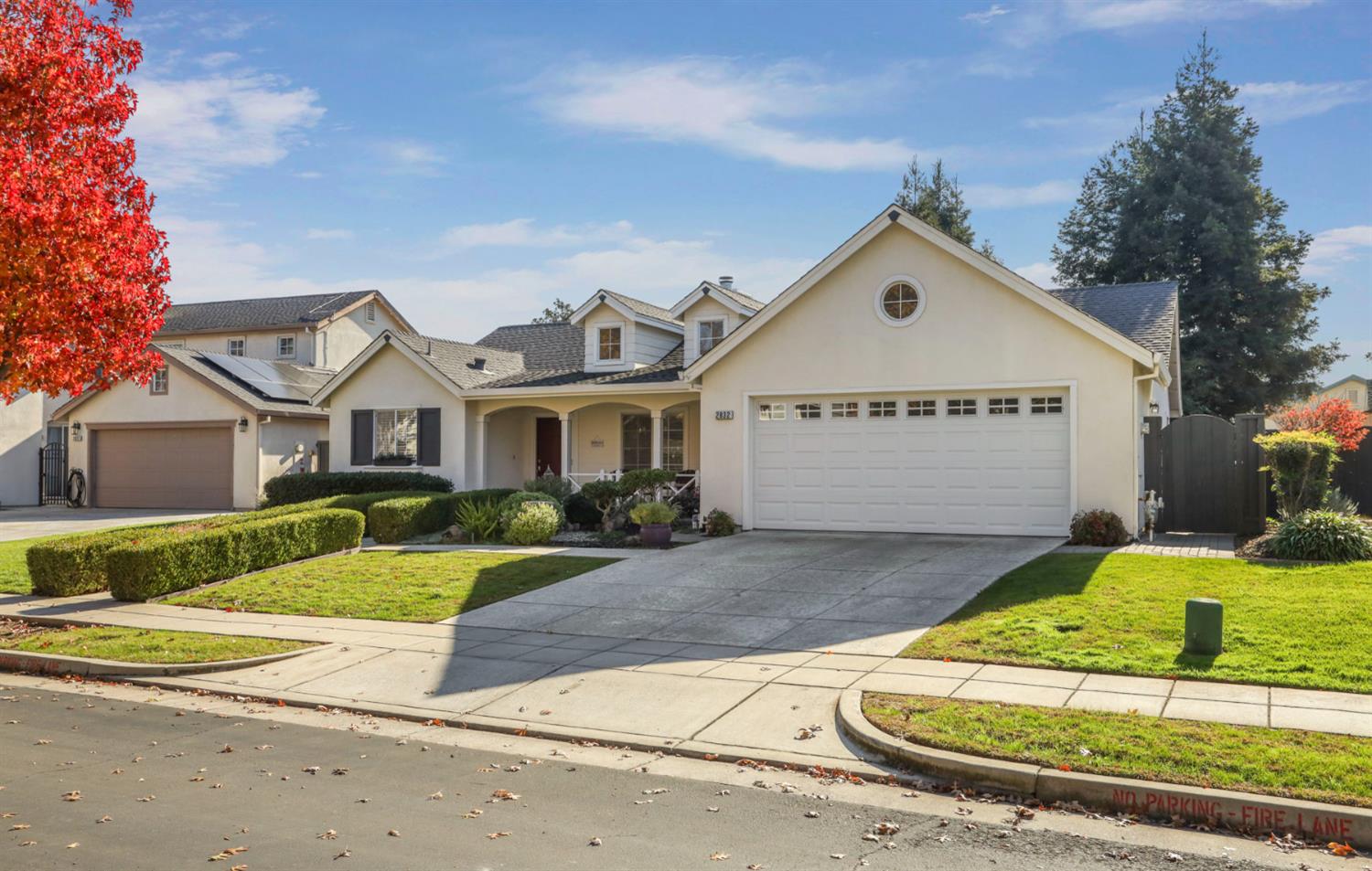 2832 Remington Way Tracy, CA 95377 - Photo 3 of 67 a front view of a house with a yard and garage