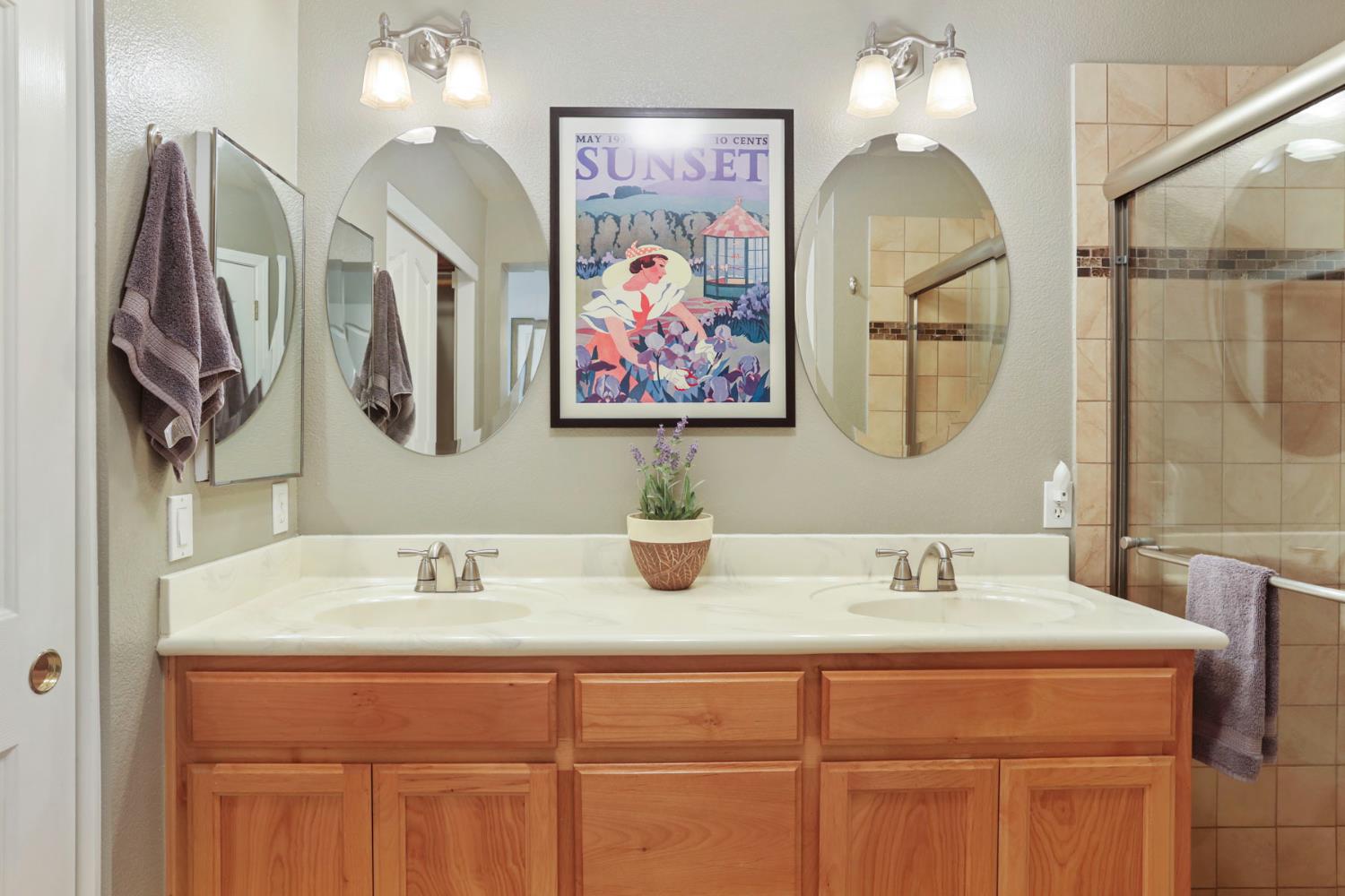 2832 Remington Way Tracy, CA 95377 - Photo 35 of 67 a bathroom with a sink double vanity and a mirror