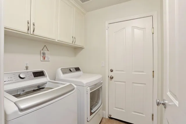 a view of a garden with plants and a fountain