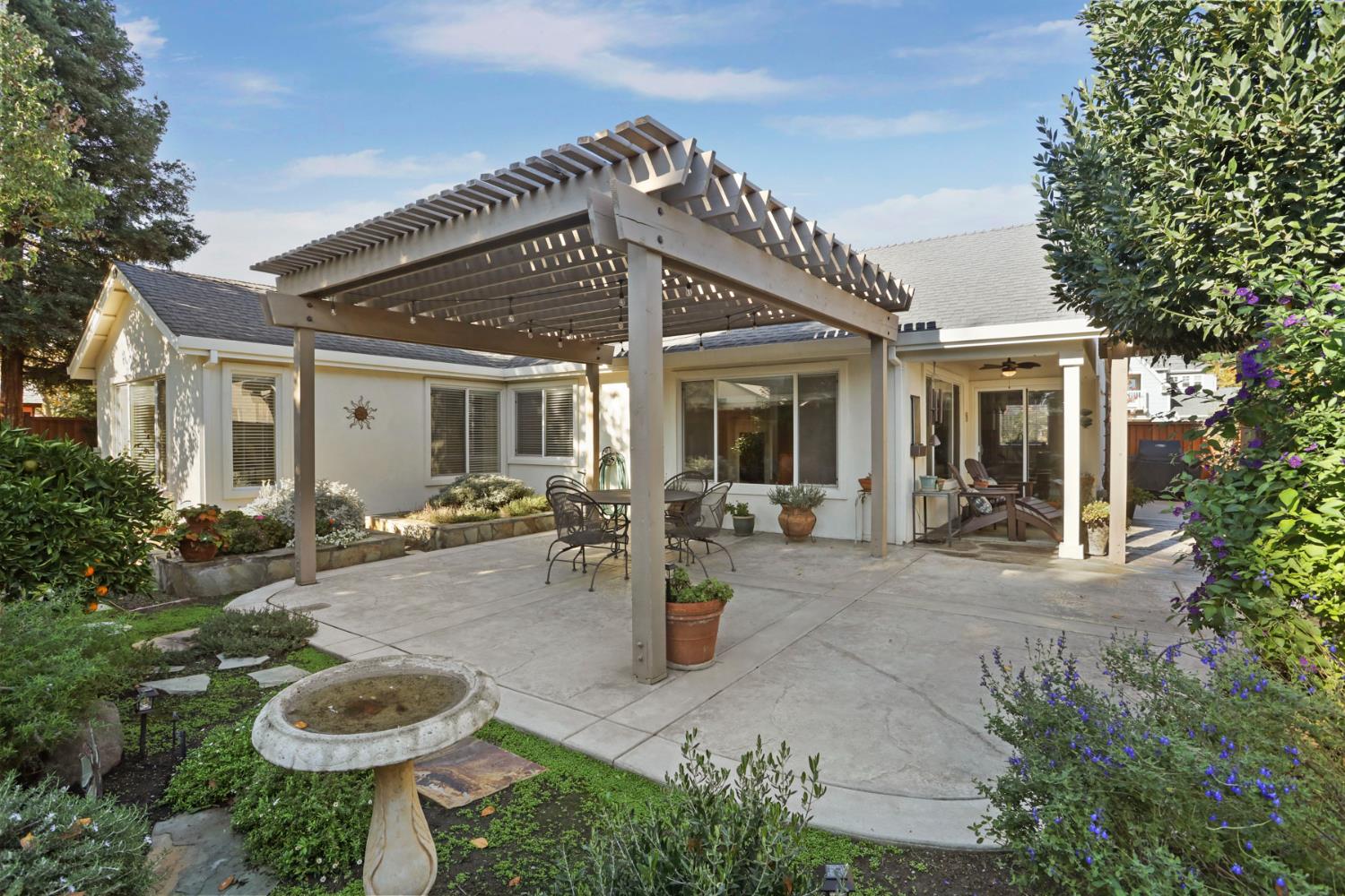 2832 Remington Way Tracy, CA 95377 - Photo 46 of 67 a view of a house with backyard sitting area and garden