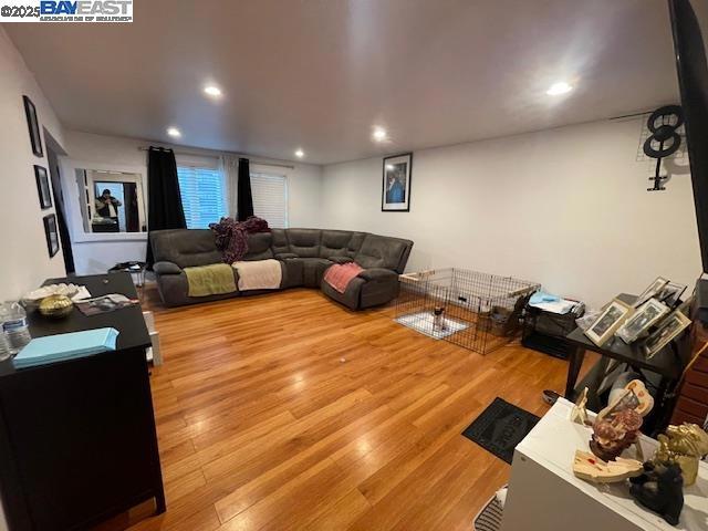 1827 Alemany Boulevard San Francisco, CA 94112 - Photo 4 of 12 a living room with furniture and a wooden floor