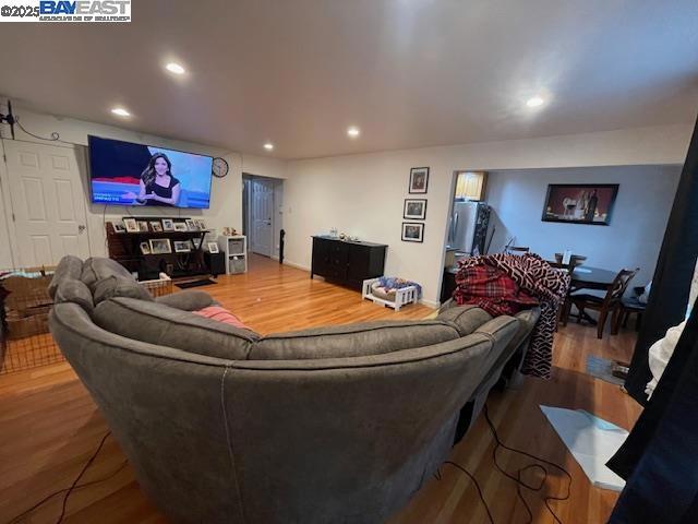 1827 Alemany Boulevard San Francisco, CA 94112 - Photo 5 of 12 a room with furniture and a flat screen tv